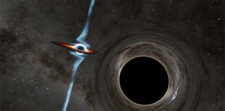 Dos agujeros negros supermasivos bailan en el corazón de una galaxia distante Este artista muestra su concepción de dos agujeros negros supermasivos candidatos en el corazón de un cuásar llamado PKS 2131-021